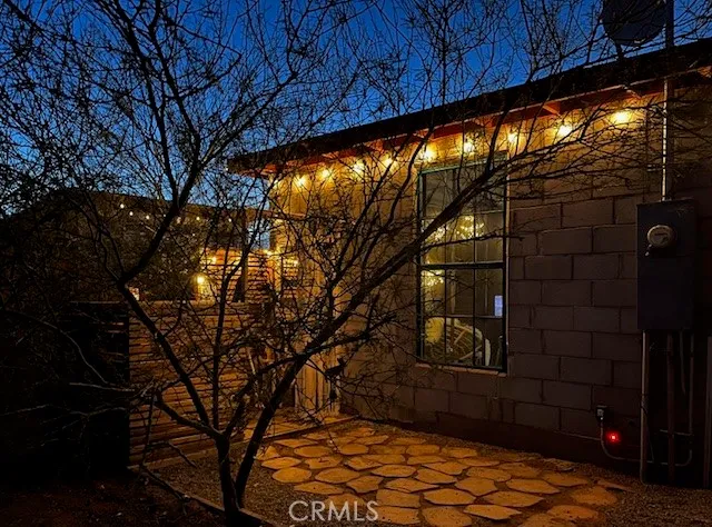 a backyard of a house with lots of green space and outdoor seating