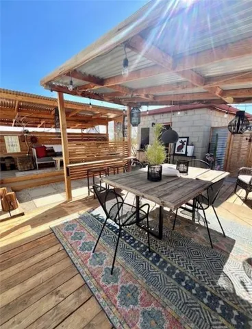 a view of a patio with table and chairs