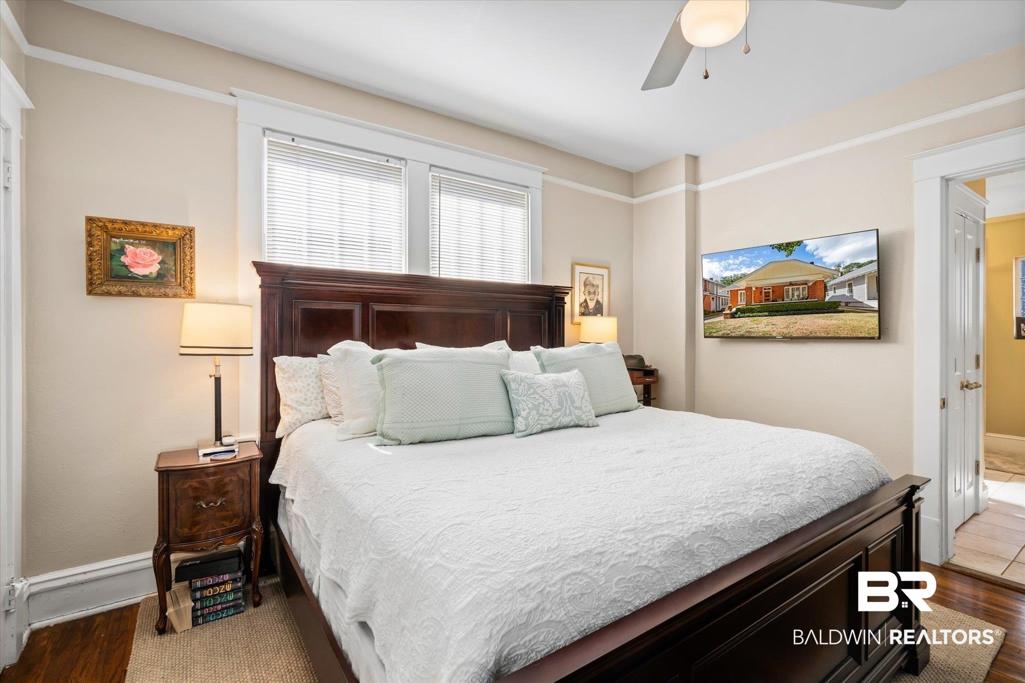 24 Macy Place Mobile, AL 36604 - Photo 23 of 38 Bedroom featuring dark wood finished floors, a ceiling fan, and baseboards