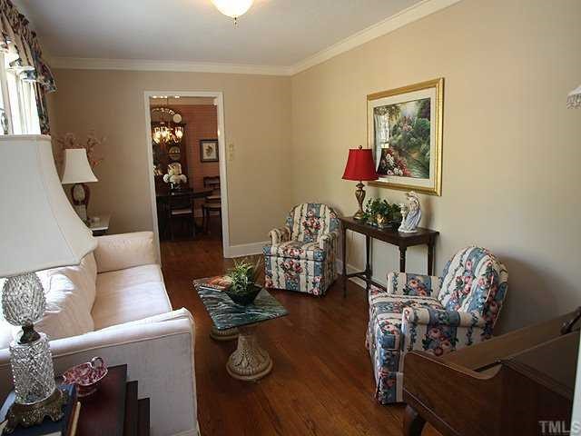 8609 Maidstone Court Raleigh, NC 27613 - Photo 2 of 12 a living room with furniture and wooden floor