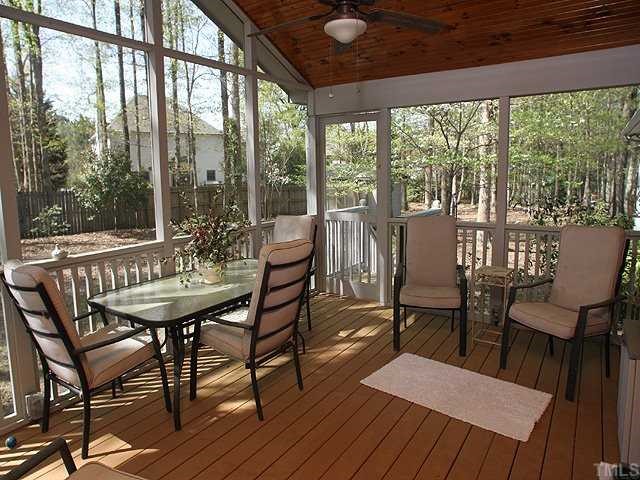 8609 Maidstone Court Raleigh, NC 27613 - Photo 10 of 12 a view of a dining room with furniture and wooden floor