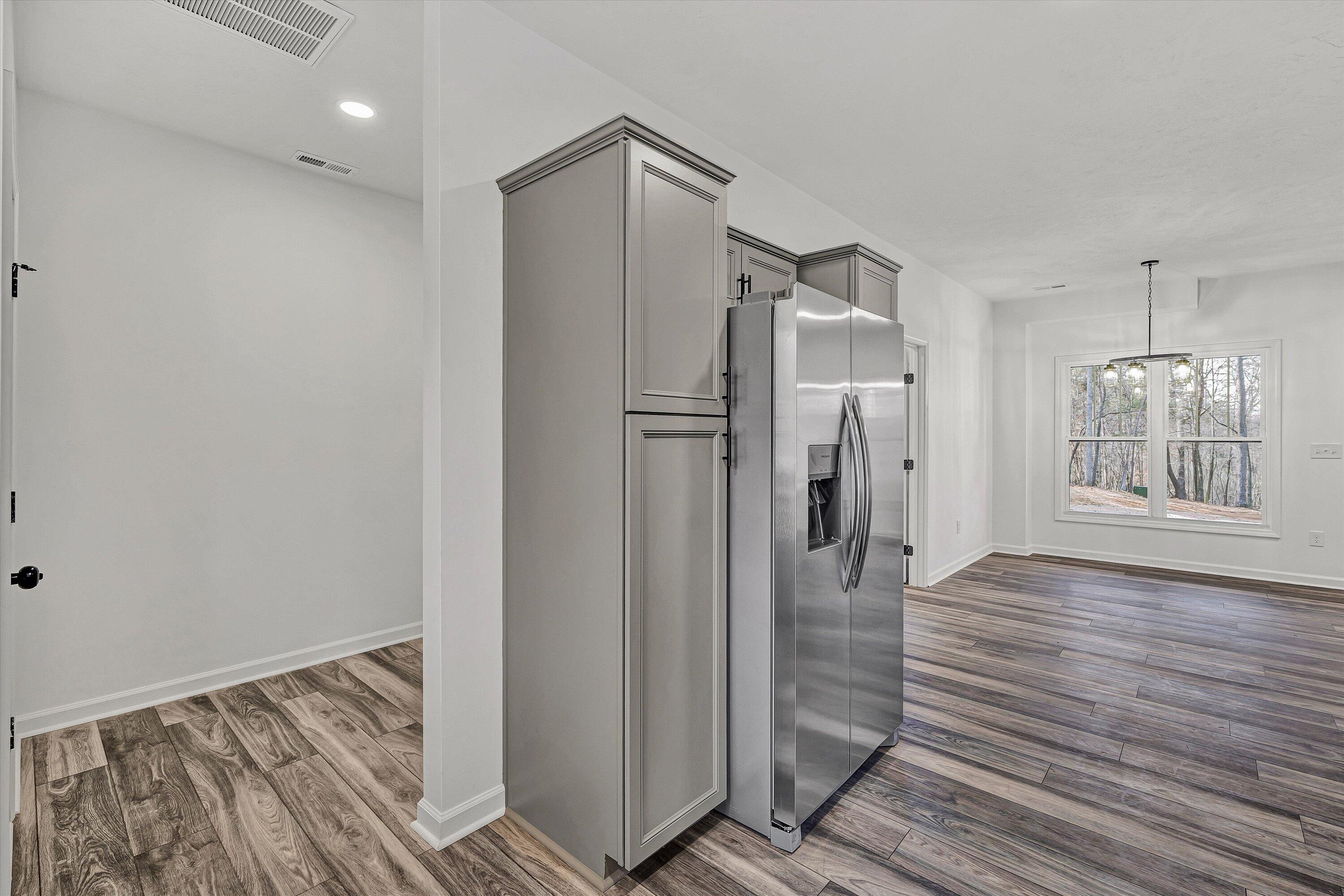103 Bluff Court Moneta, VA 24121 - Photo 14 of 63 a big room with wooden floor and a bathroom