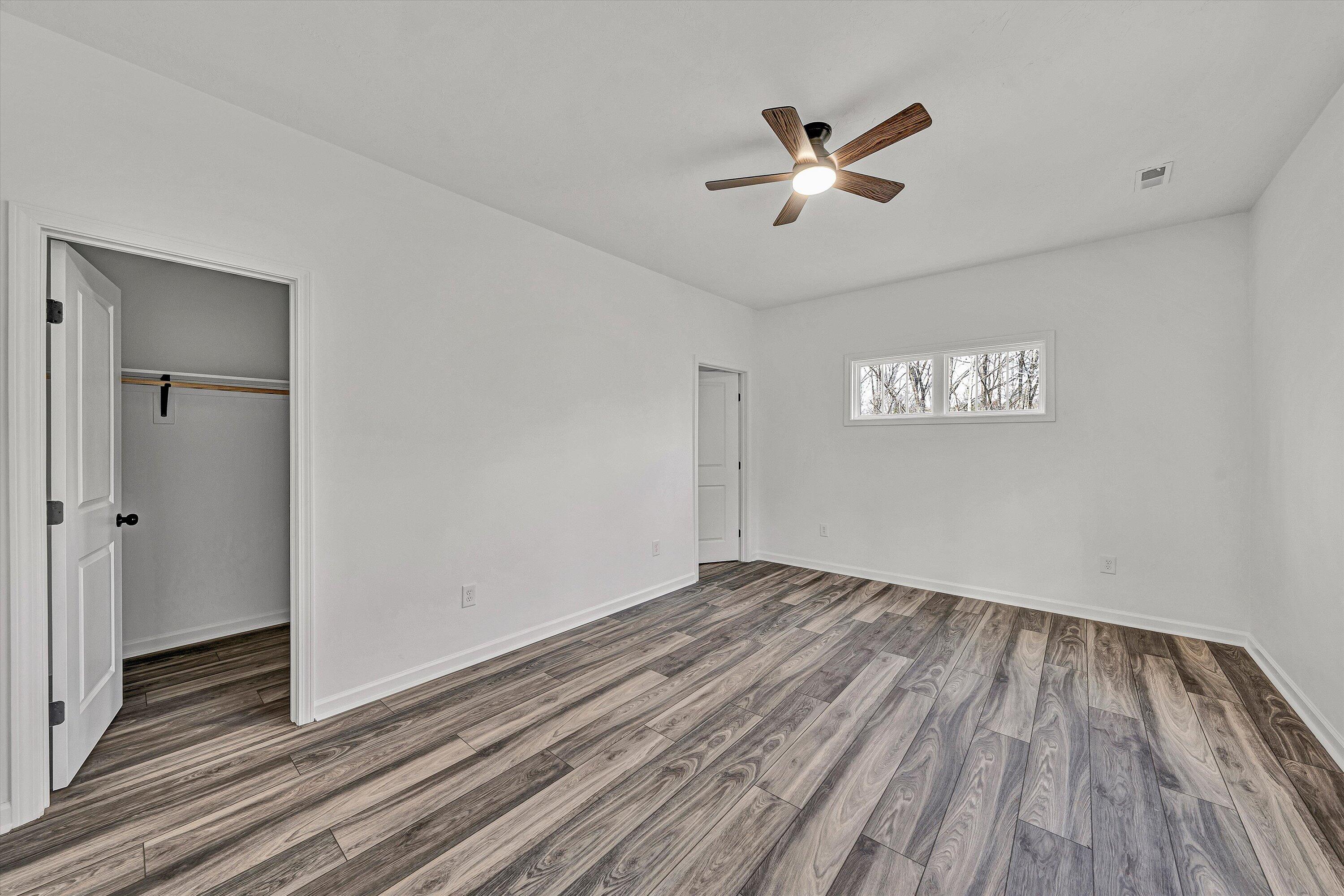 103 Bluff Court Moneta, VA 24121 - Photo 19 of 63 a view of empty room with wooden floor