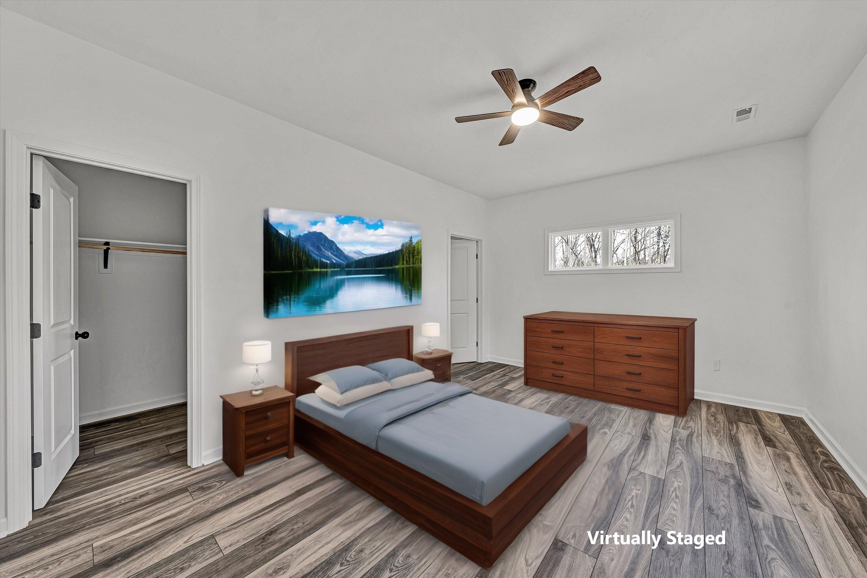 103 Bluff Court Moneta, VA 24121 - Photo 20 of 63 a bedroom with a bed and a flat screen tv