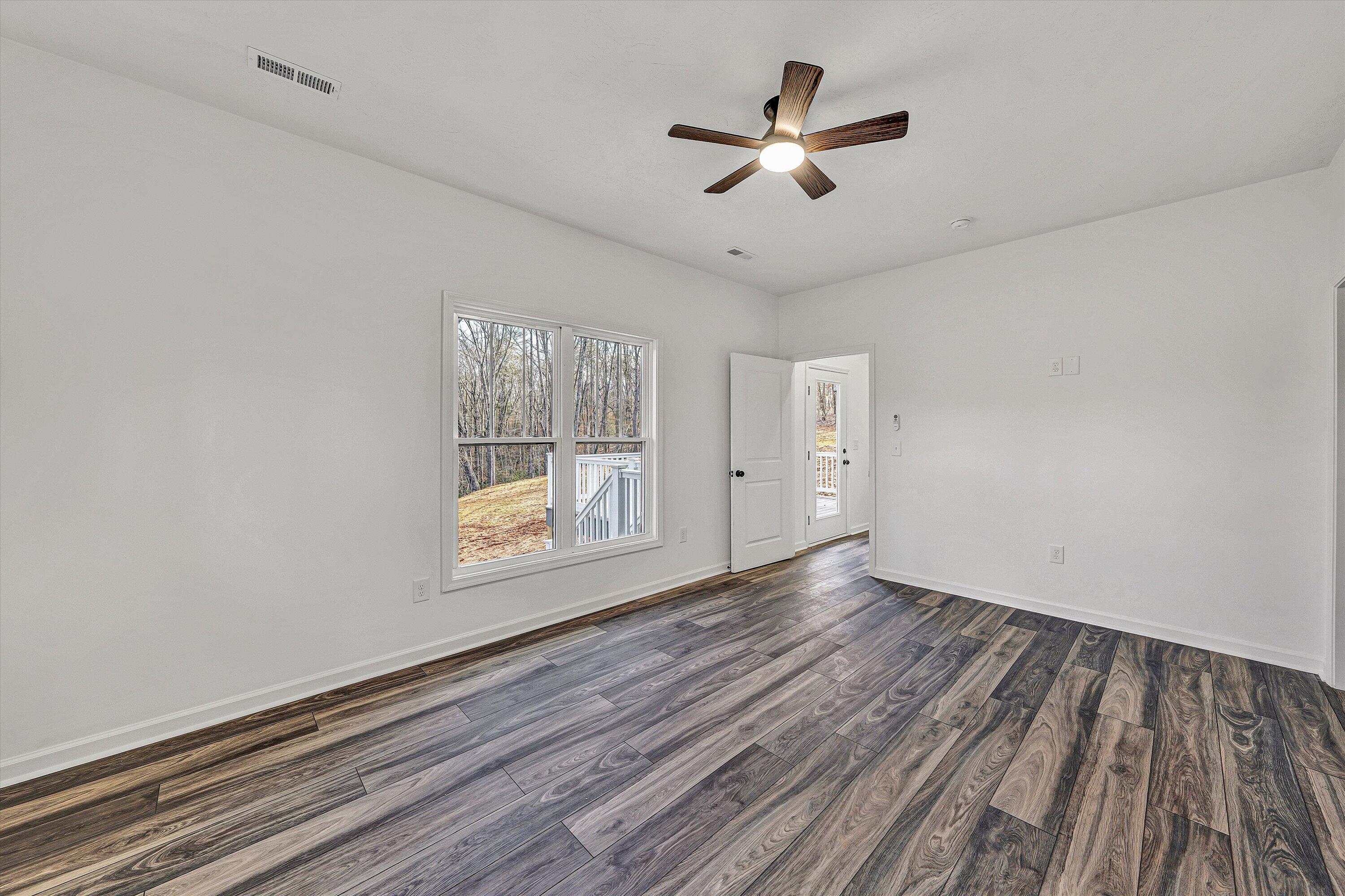 103 Bluff Court Moneta, VA 24121 - Photo 21 of 63 wooden floor in an empty room with a window