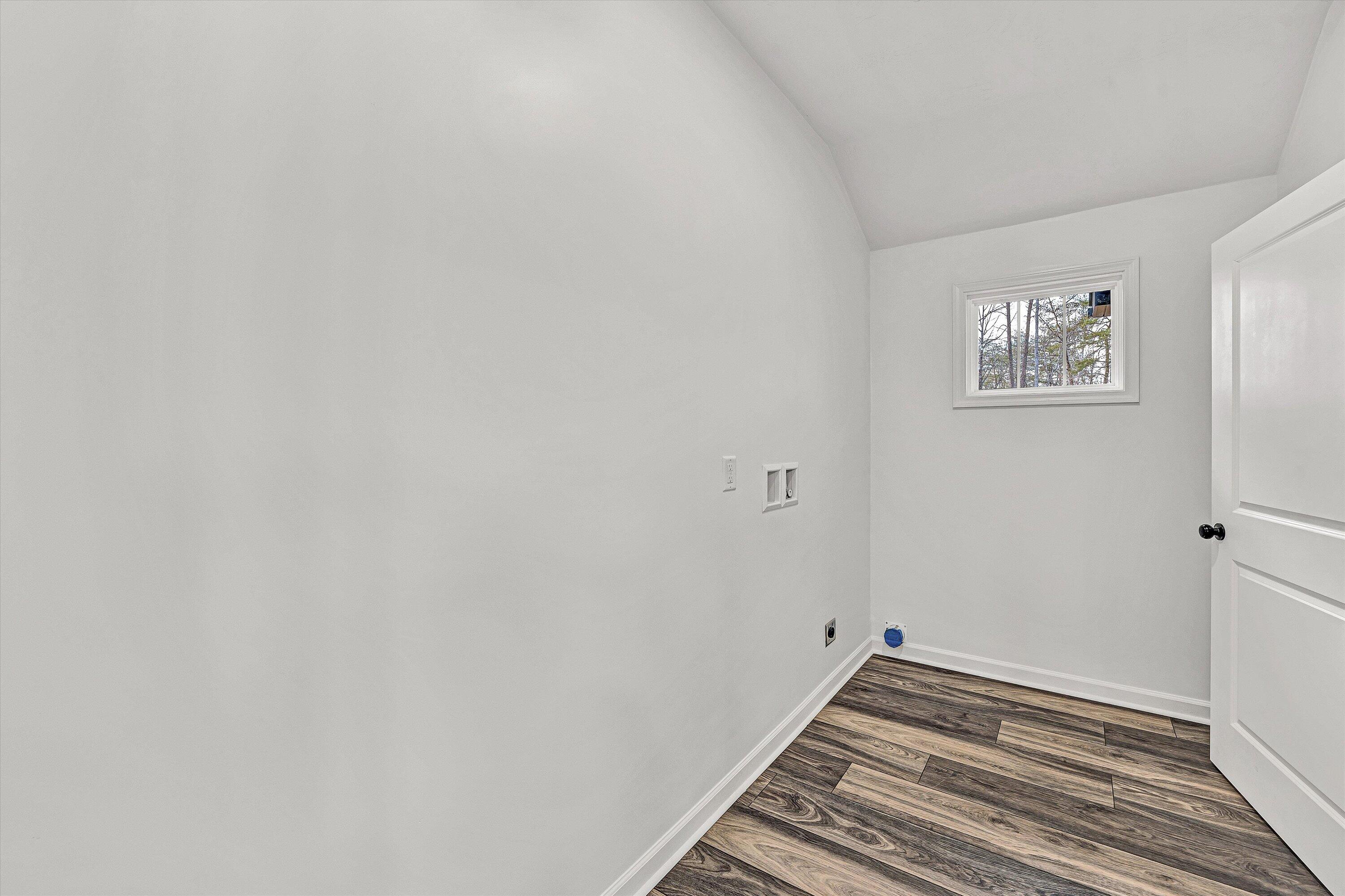 103 Bluff Court Moneta, VA 24121 - Photo 25 of 63 a view of a room with wooden floor and white walls