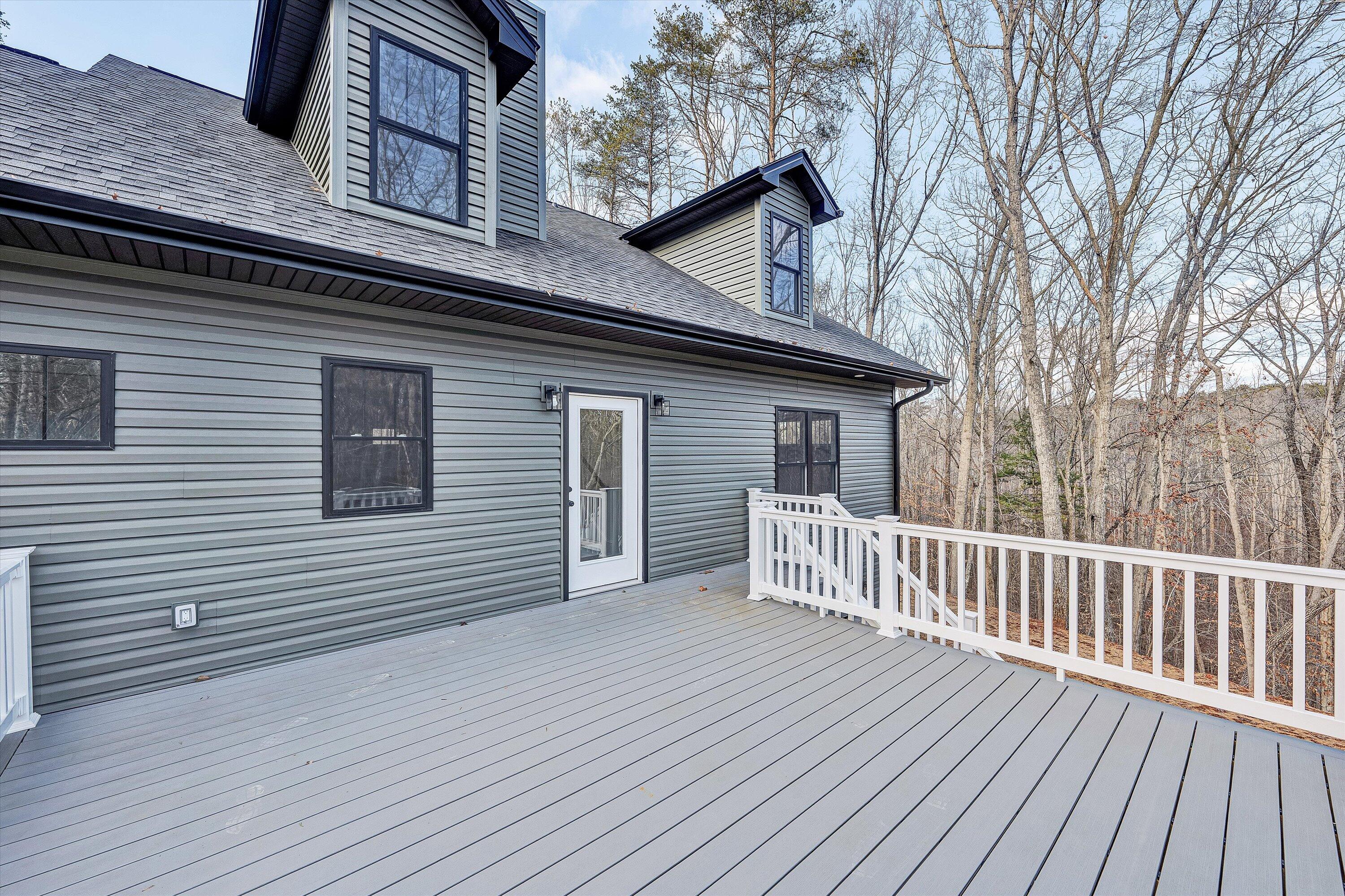 103 Bluff Court Moneta, VA 24121 - Photo 30 of 63 a view of a house with a deck