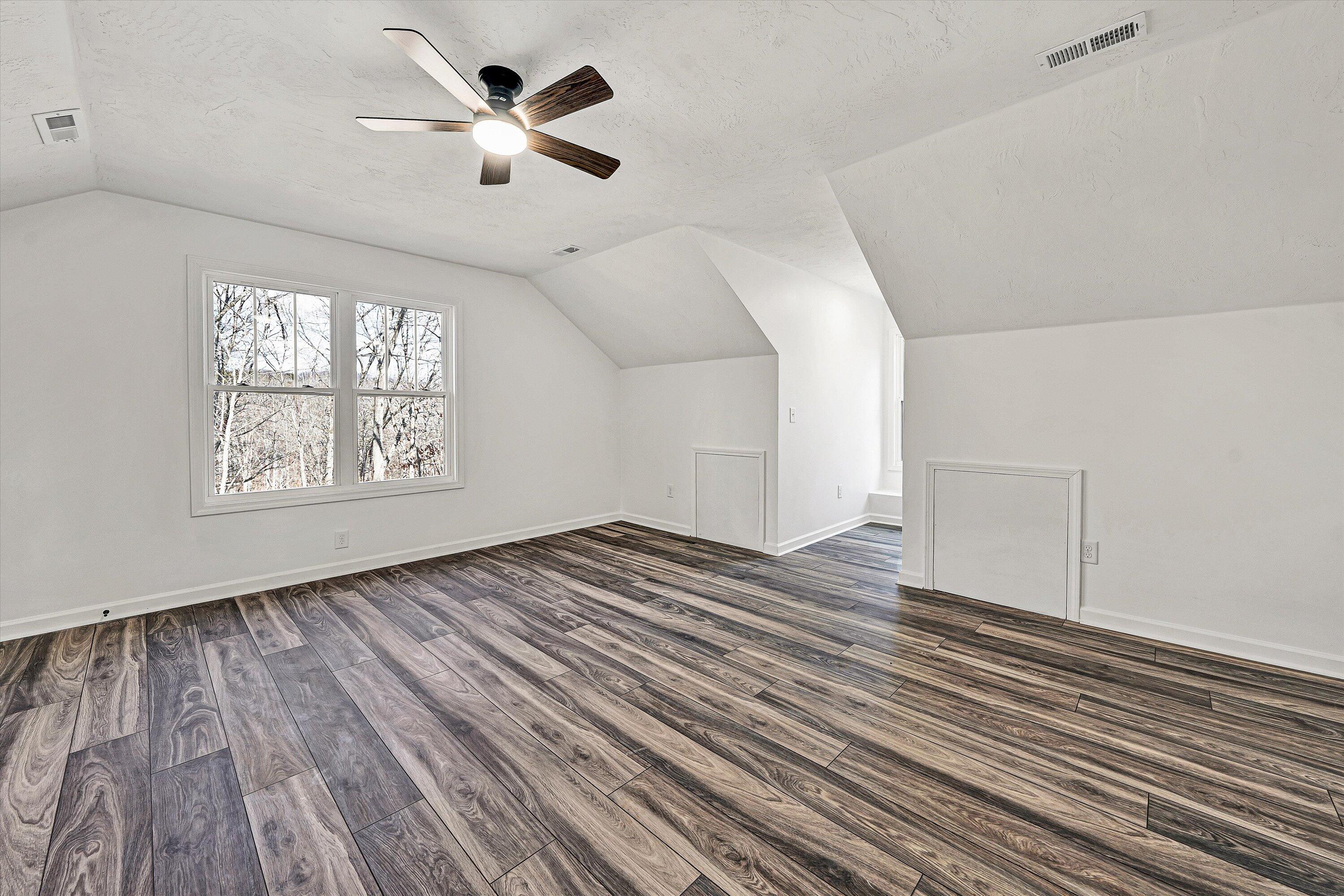 103 Bluff Court Moneta, VA 24121 - Photo 35 of 63 wooden floor in an empty room with a window