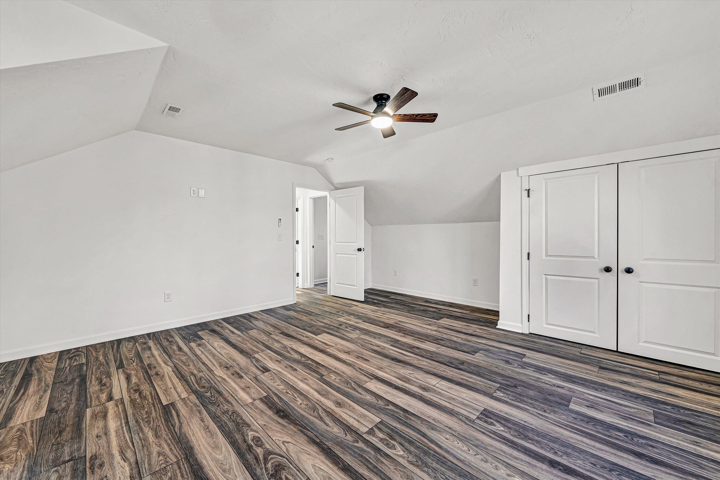 103 Bluff Court Moneta, VA 24121 - Photo 36 of 63 a view of empty room with wooden floor and fan