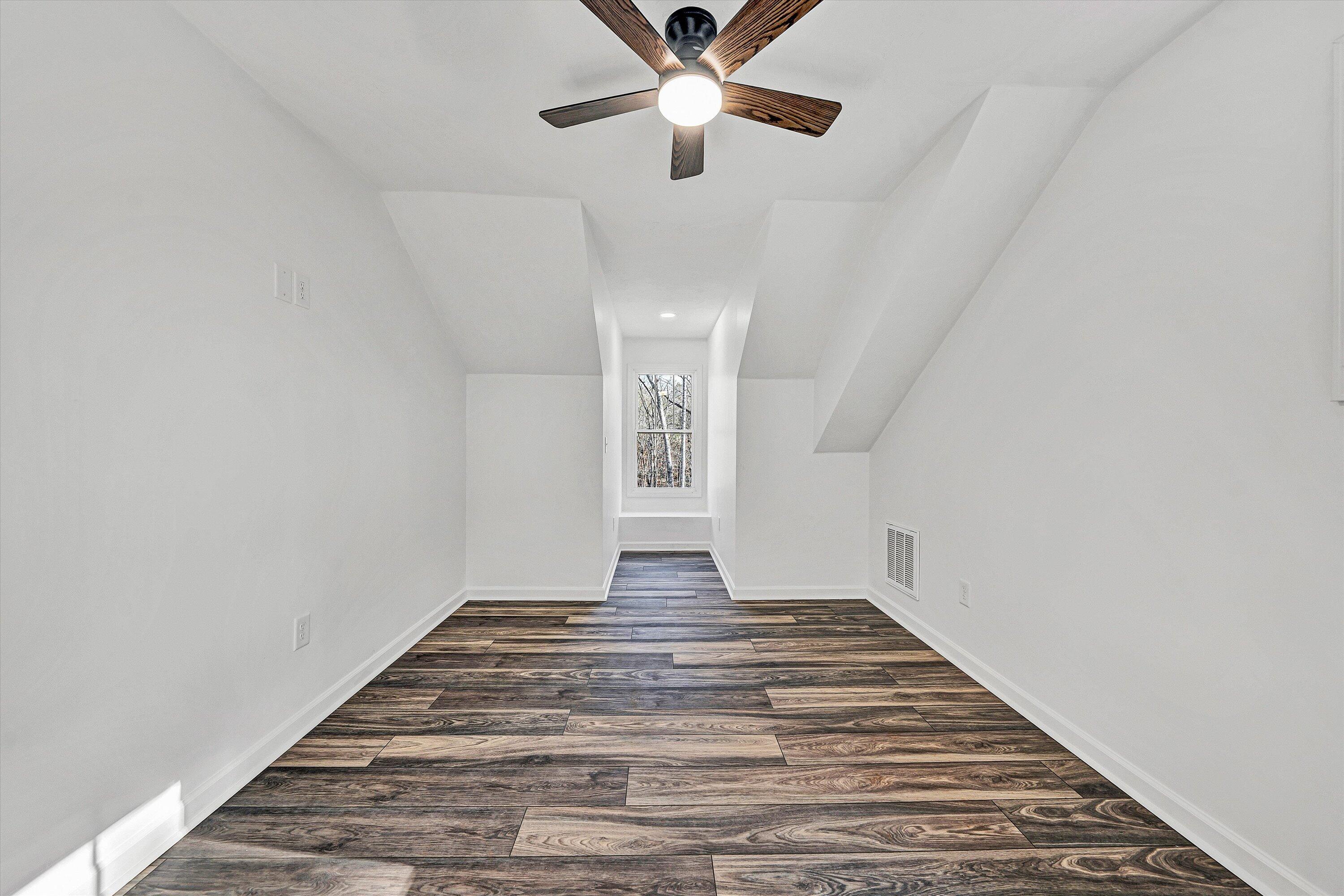 103 Bluff Court Moneta, VA 24121 - Photo 38 of 63 a view of empty room with wooden floor and fan