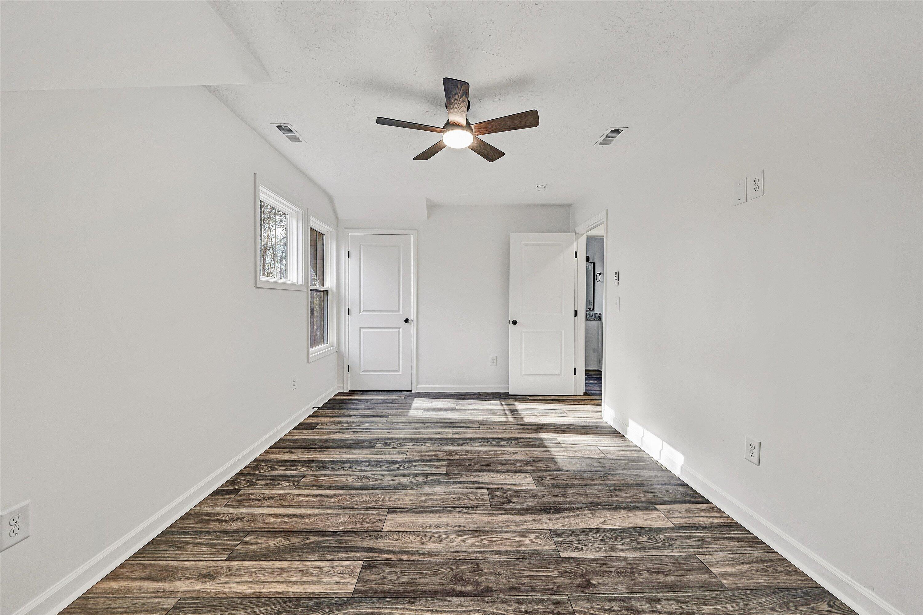 103 Bluff Court Moneta, VA 24121 - Photo 39 of 63 a view of empty room with wooden floor