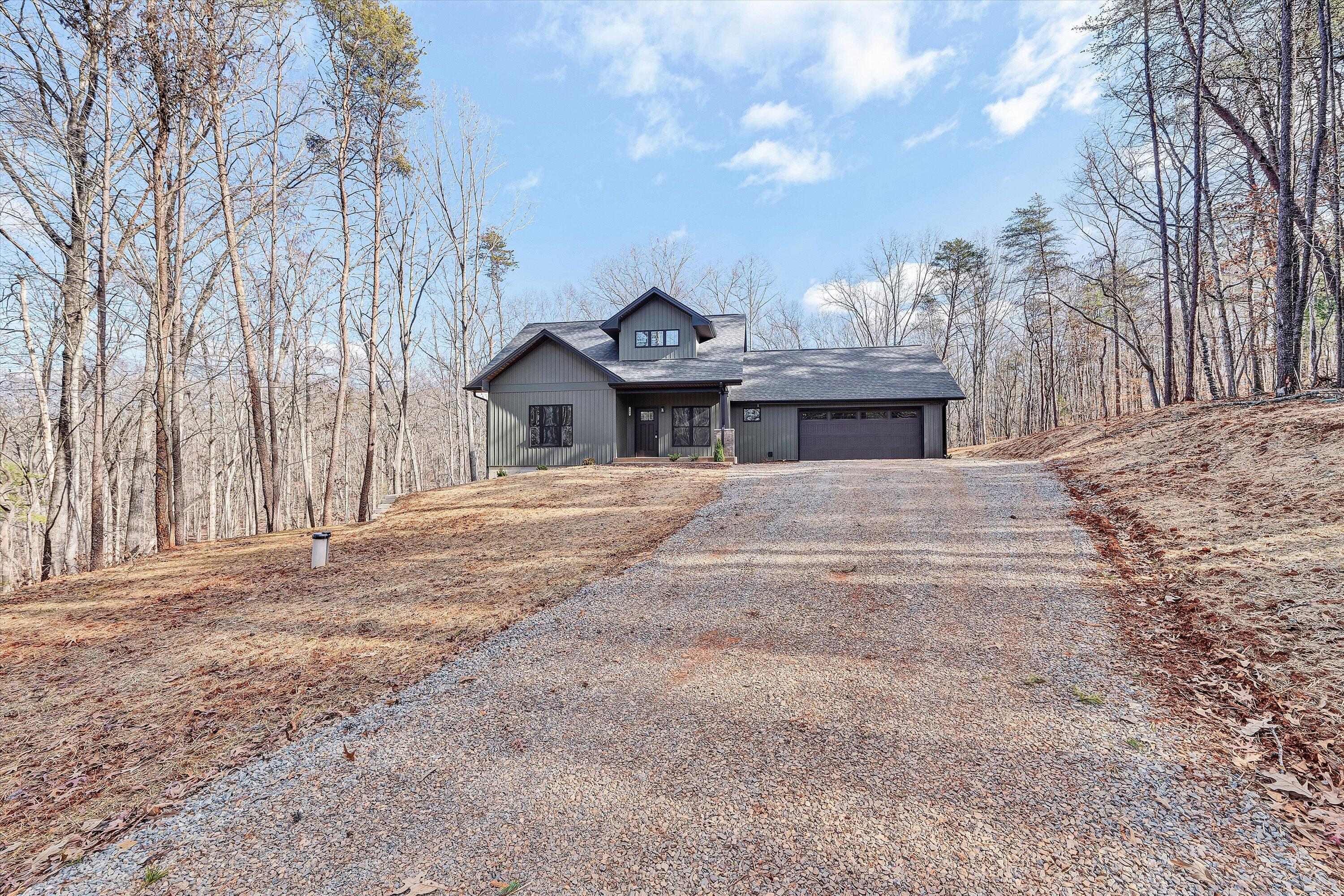 103 Bluff Court Moneta, VA 24121 - Photo 48 of 63 a front view of a house with a yard