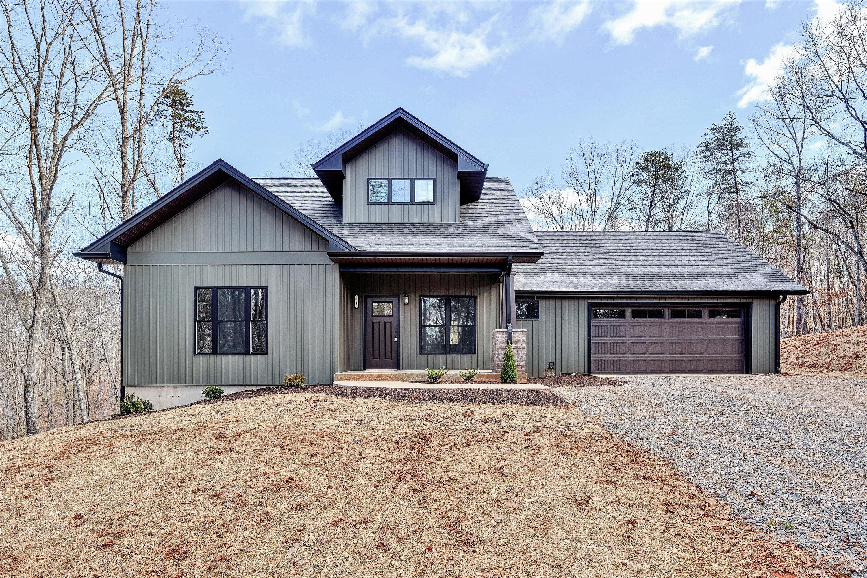 103 Bluff Court Moneta, VA 24121 - Photo 49 of 63 a front view of a house with a yard and garage