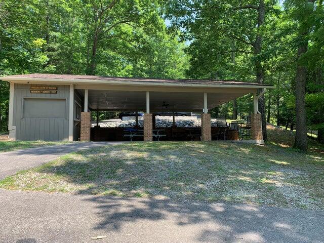 103 Bluff Court Moneta, VA 24121 - Photo 56 of 63 a view of a backyard with table and chairs and potted plants