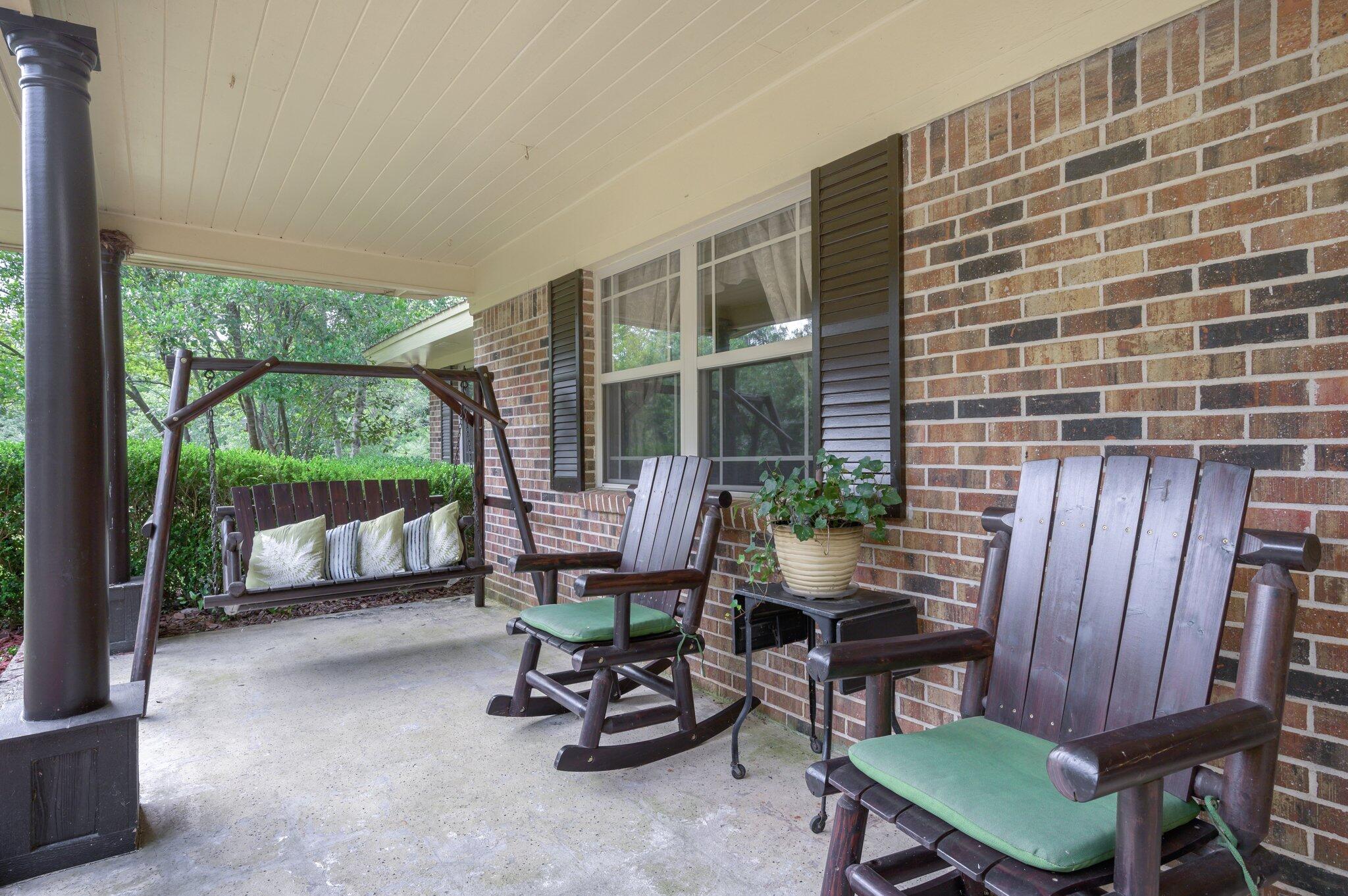 4082 Painter Branch Road Crestview, FL 32539 - Photo 4 of 49 a view of a chairs and table in patio