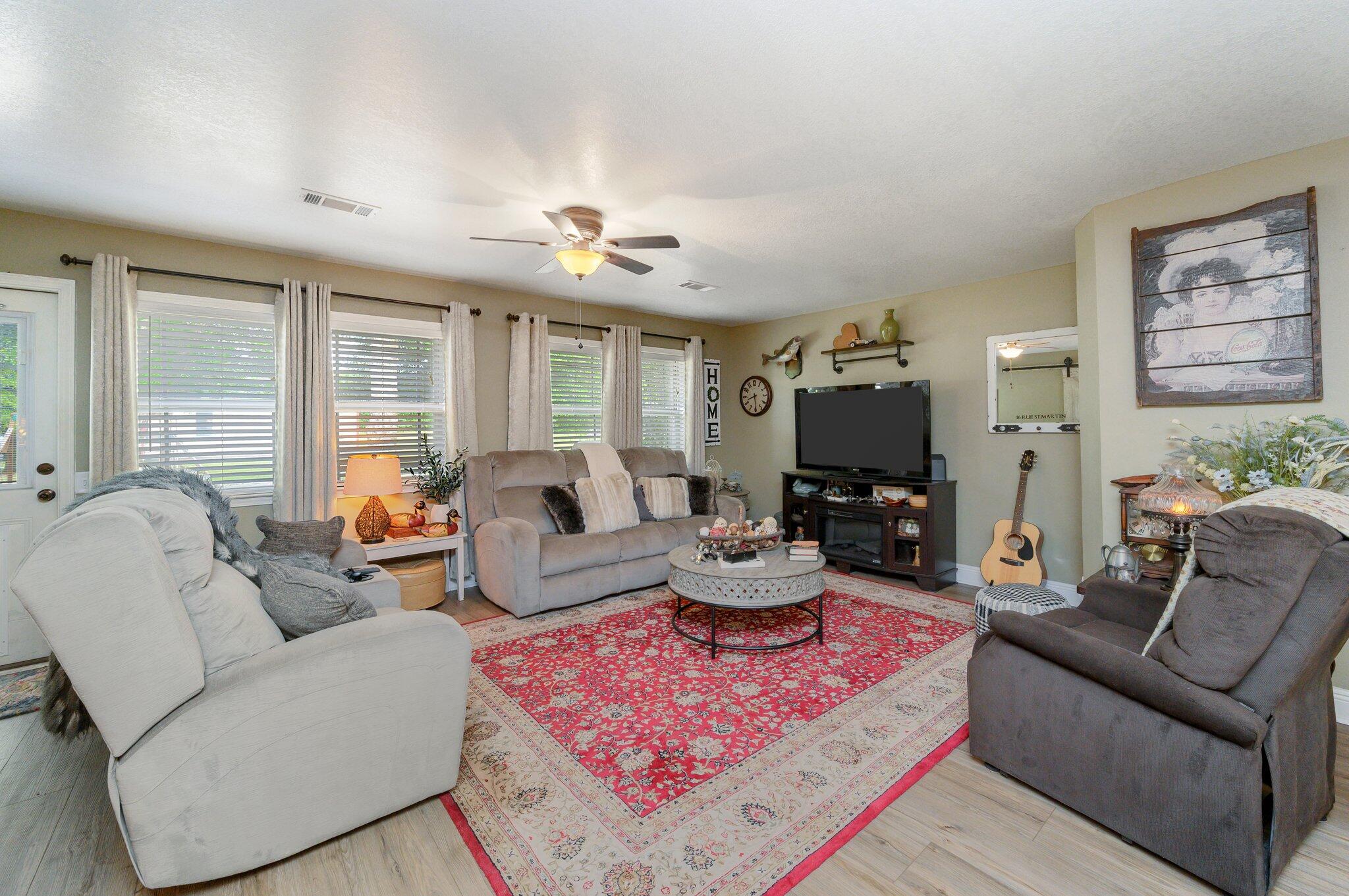 4082 Painter Branch Road Crestview, FL 32539 - Photo 6 of 49 a living room with furniture and a large window
