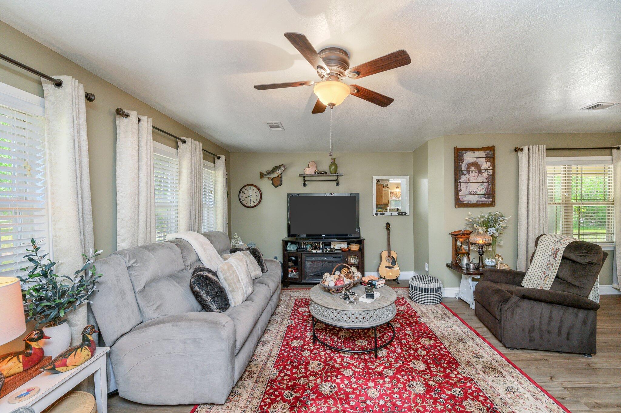 4082 Painter Branch Road Crestview, FL 32539 - Photo 7 of 49 a living room with furniture and a large window