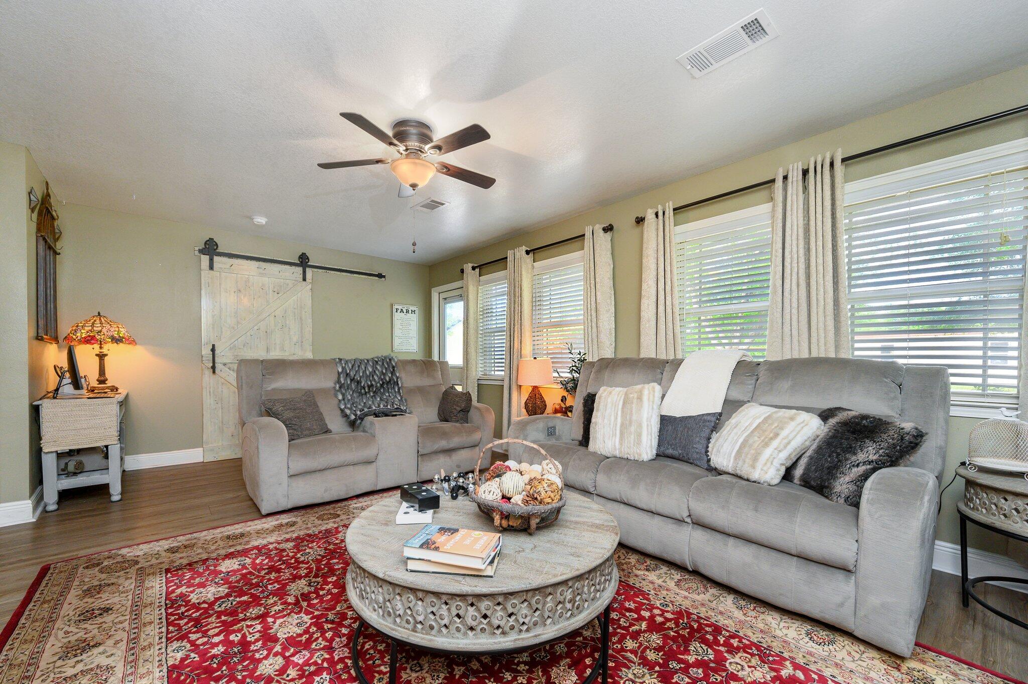 4082 Painter Branch Road Crestview, FL 32539 - Photo 8 of 49 a living room with furniture and a rug