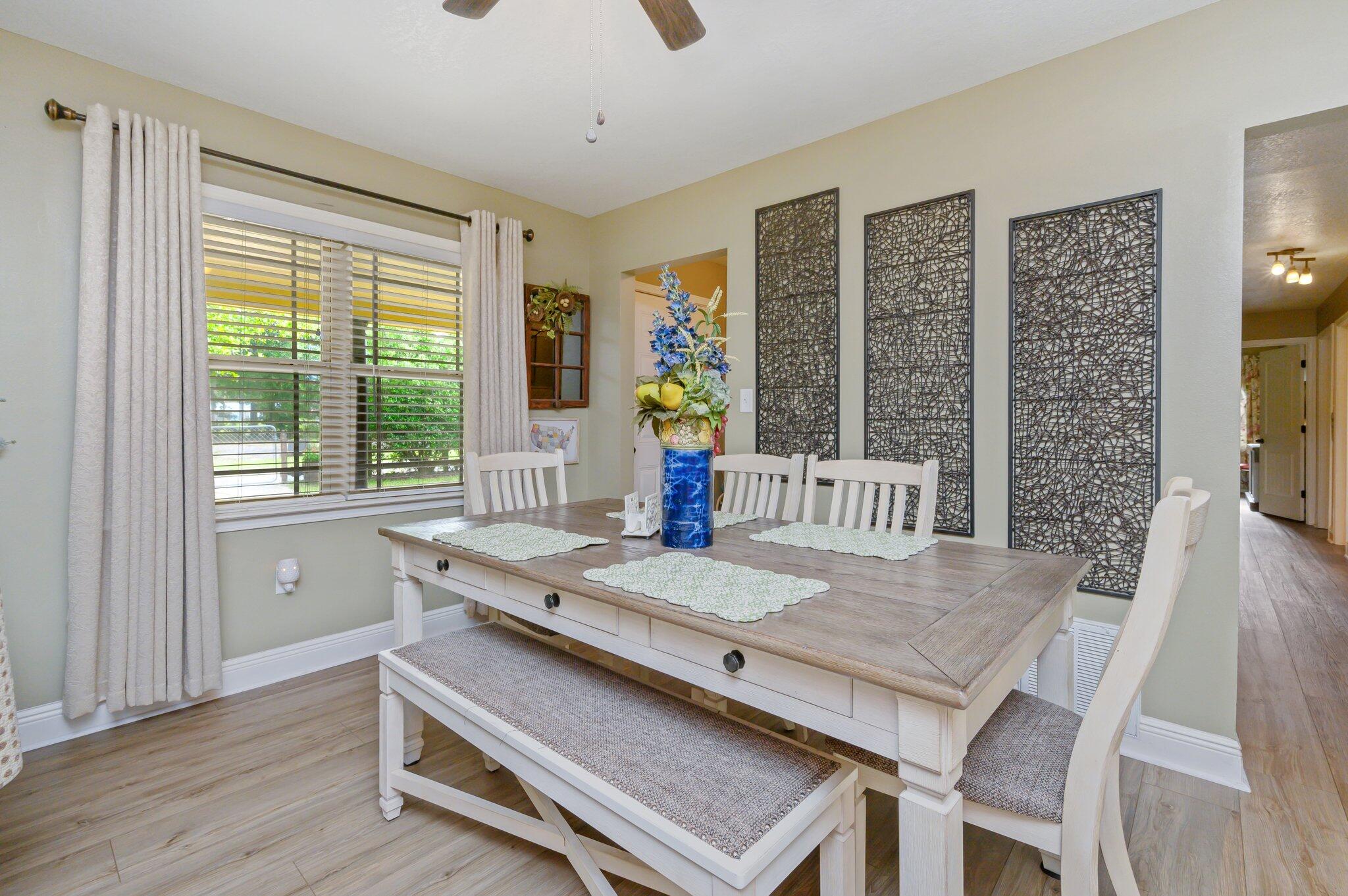 4082 Painter Branch Road Crestview, FL 32539 - Photo 9 of 49 a view of a dining room with furniture window and wooden floor