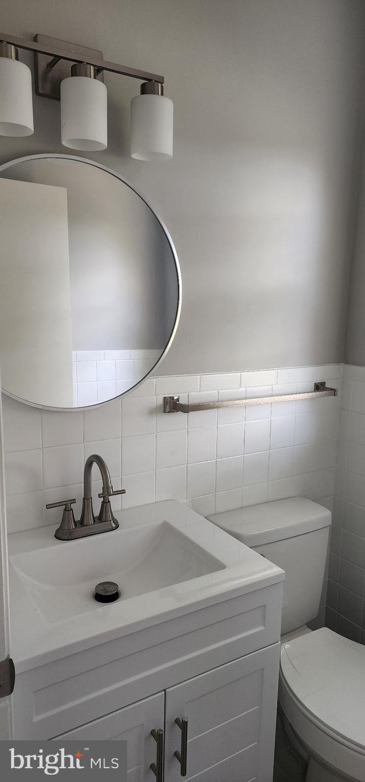 8432 Meadow Bridge Road Eden, MD 21822 - Photo 19 of 42 Sleek modern bathroom with elegant fixtures.