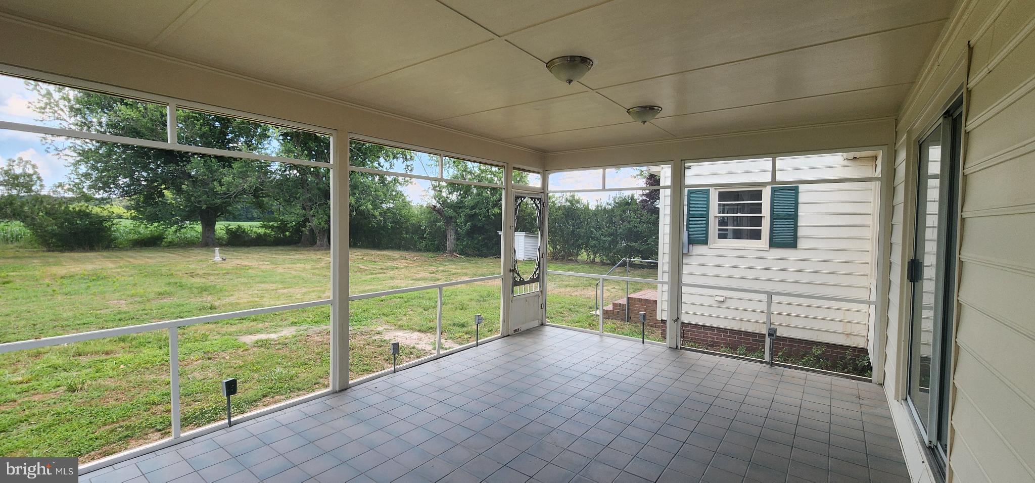 8432 Meadow Bridge Road Eden, MD 21822 - Photo 4 of 42 Serene screened porch with lush backyard views.