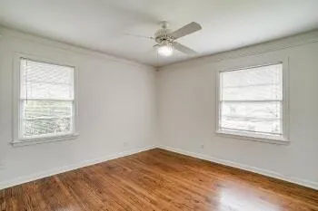 a view of an empty room with a window