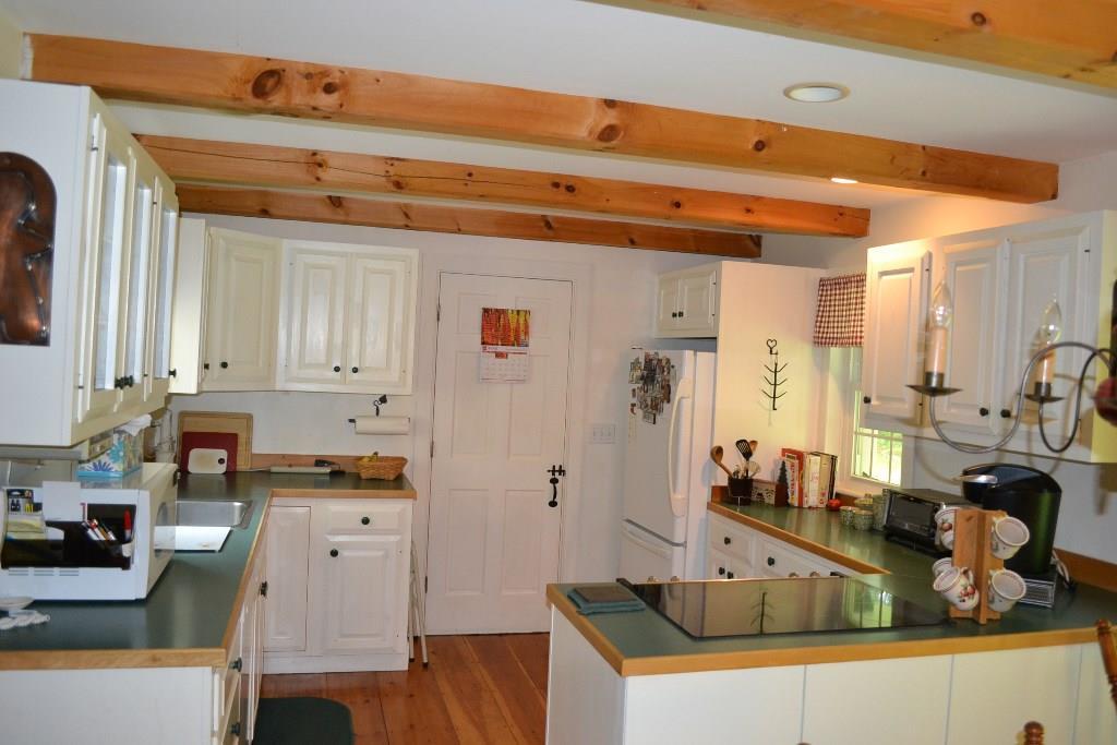 22 Woodward Farm Road Bristol, ME 04539 - Photo 5 of 25 Kitchen with pine flooring