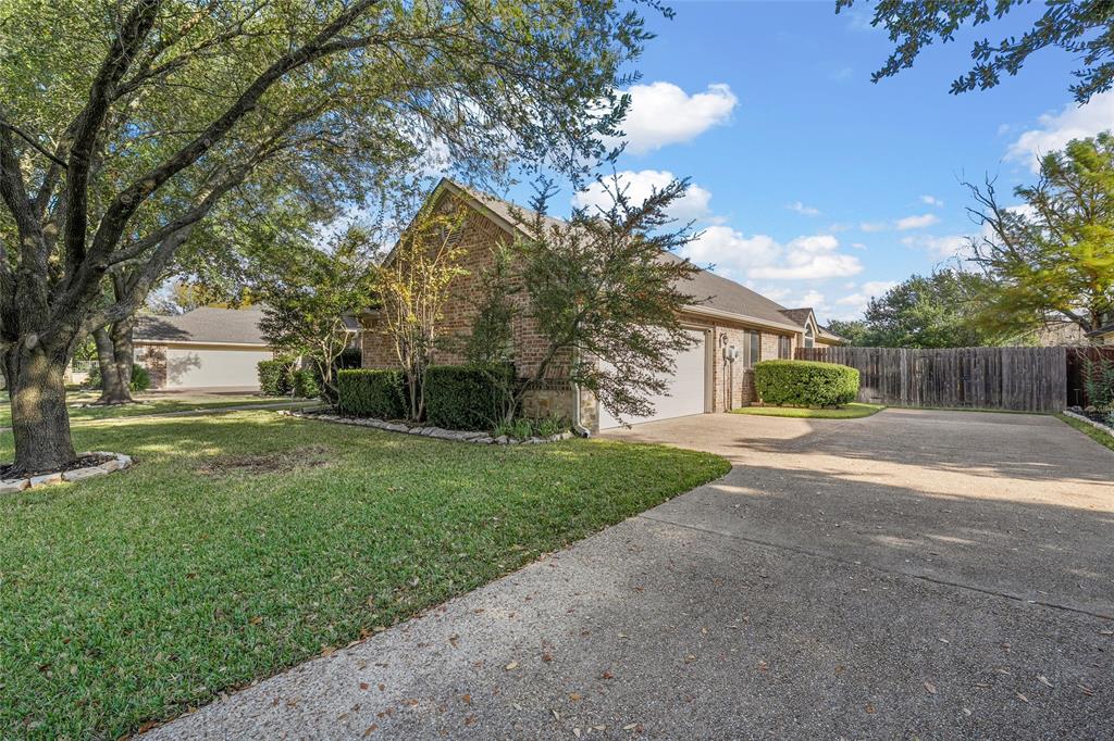 302 Canterbury Road Waco, TX 76712 - Photo 3 of 29 a view of a house with a yard