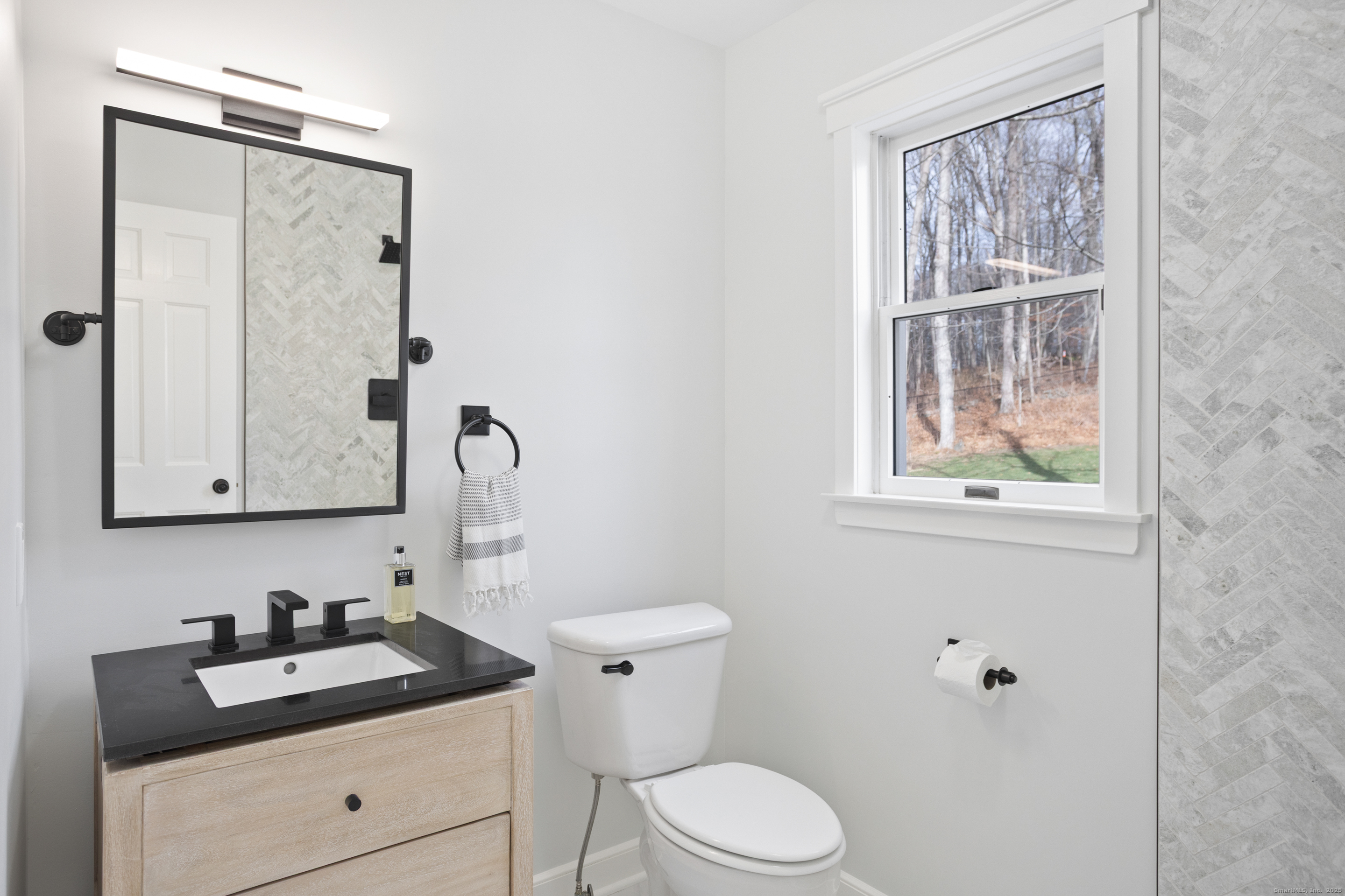 41 Deer Hill Road Redding, CT 06896 - Photo 14 of 31 a bathroom with a granite countertop sink toilet and mirror