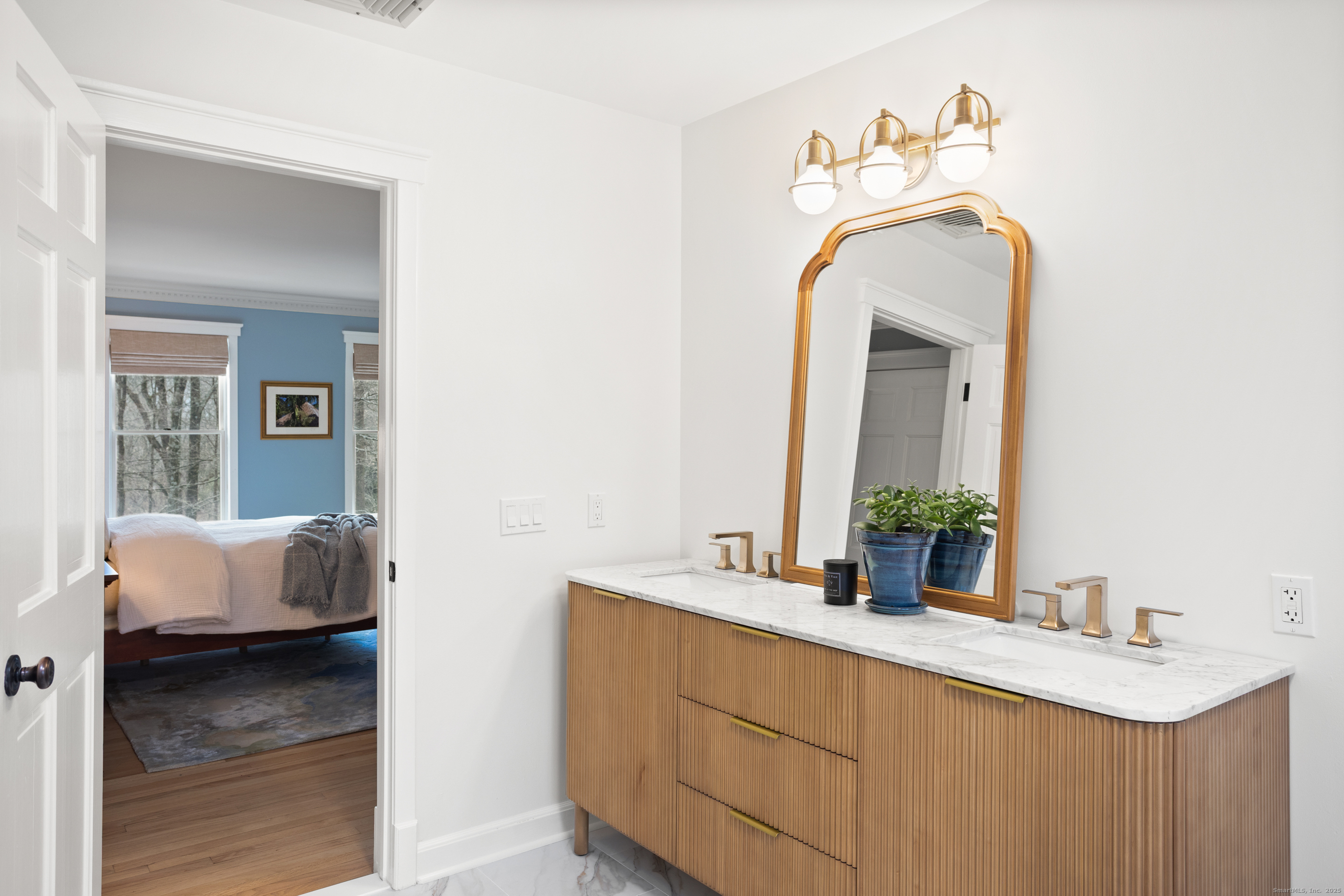 41 Deer Hill Road Redding, CT 06896 - Photo 19 of 31 a en suite bathroom with a sink and a mirror