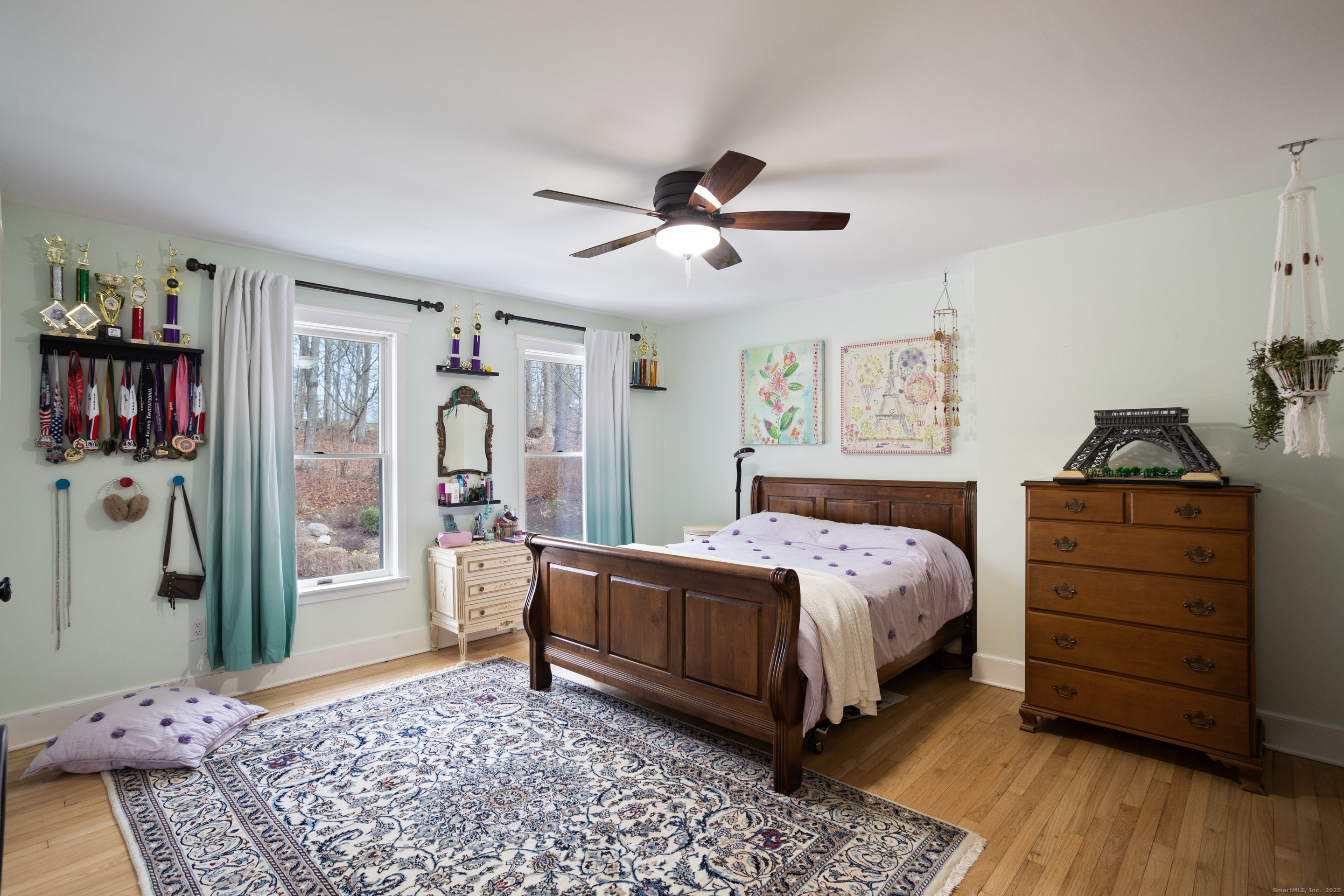 41 Deer Hill Road Redding, CT 06896 - Photo 21 of 31 a bedroom with a bed and wooden floor