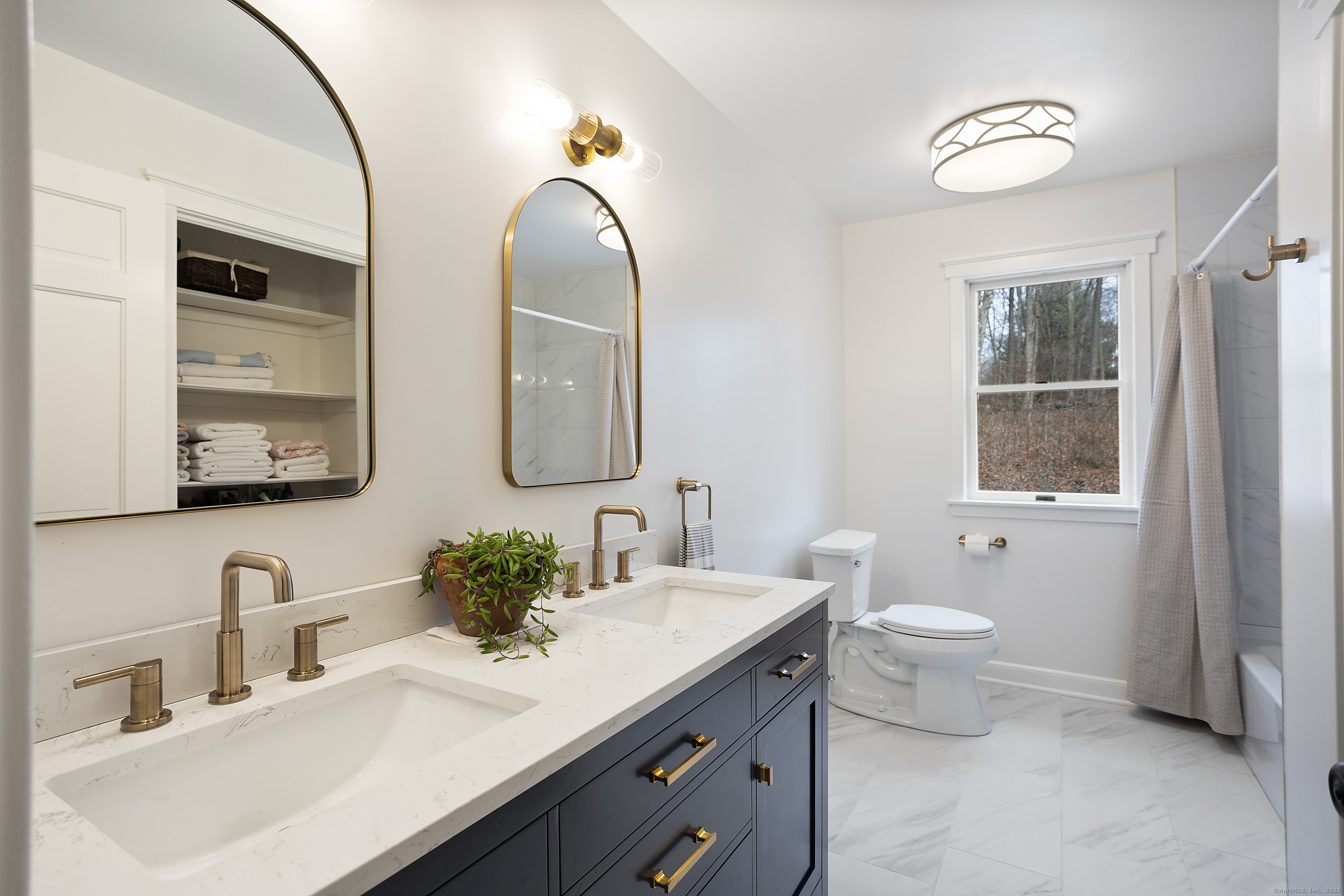 41 Deer Hill Road Redding, CT 06896 - Photo 24 of 31 a bathroom with 2 sink and a mirror
