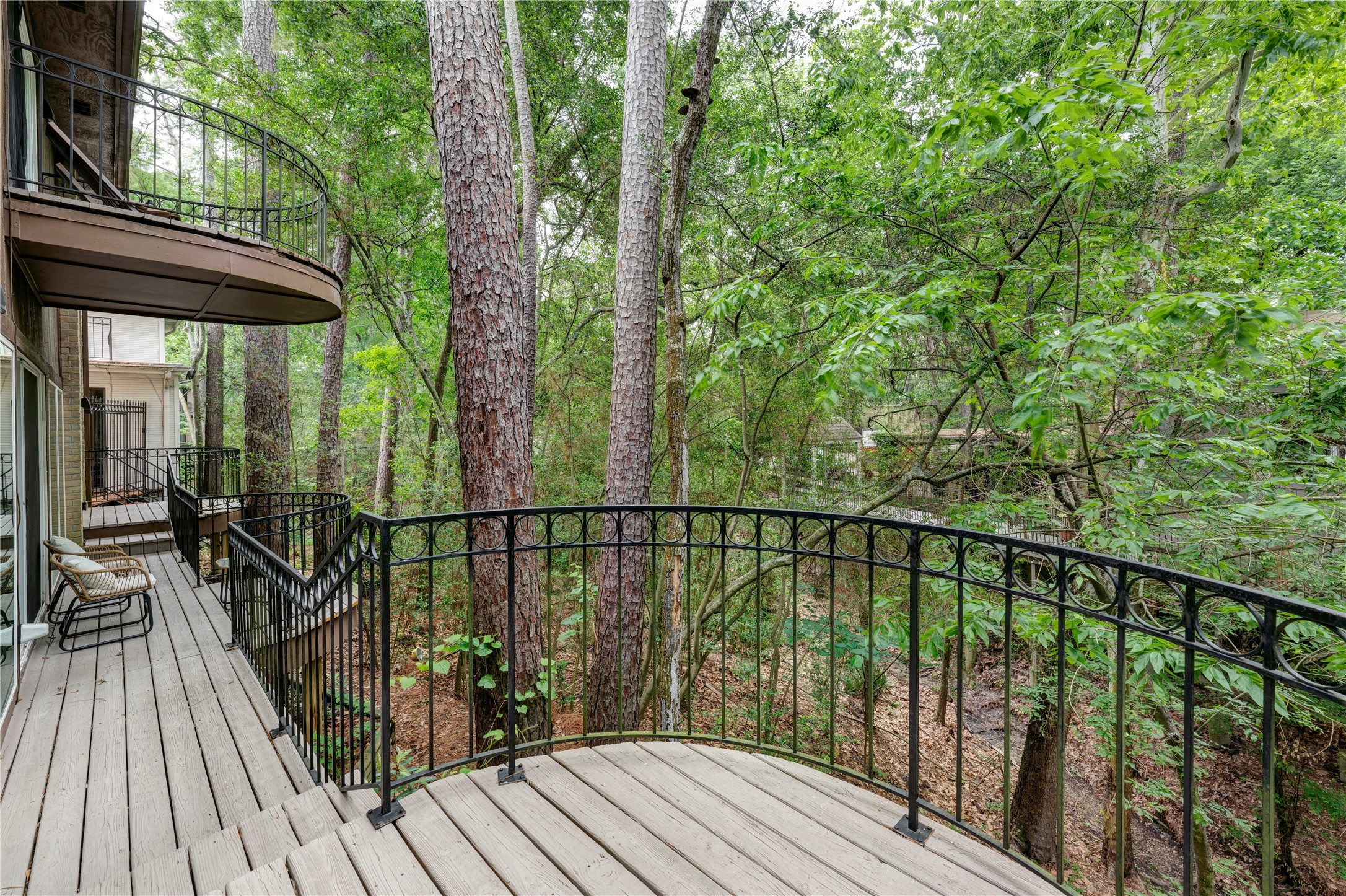 201 Vanderpool Lane, Unit 130 Houston, TX 77024 - Photo 9 of 41 Another view of the balcony from the third seating area which hovers over the ravine below.