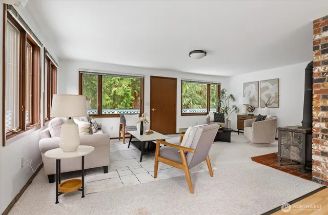 a kitchen with a table chairs sink and cabinets