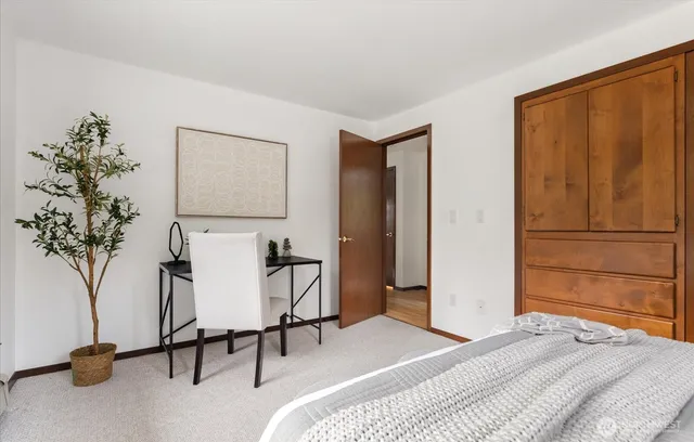 a bedroom with a bed and a couch