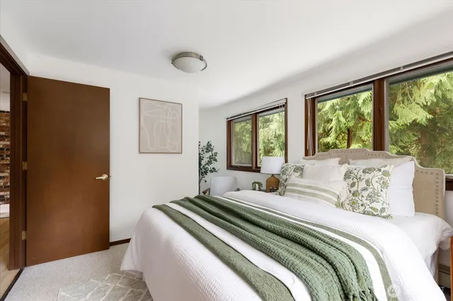 a view of living room filled with furniture and a flat screen tv