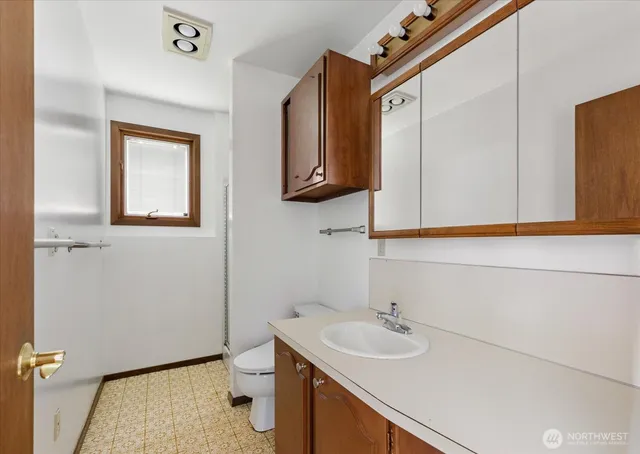 a kitchen with stainless steel appliances granite countertop a stove a sink a refrigerator and a refrigerator