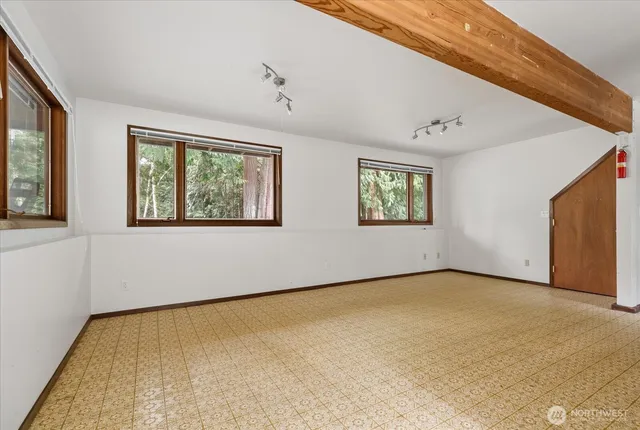 a view of an empty room with a window