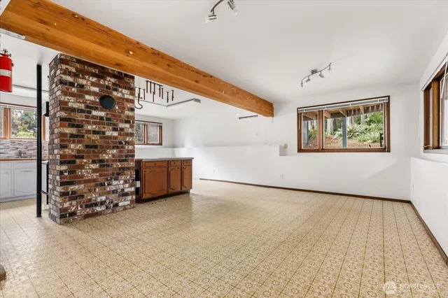 a view of a deck with a big yard and large trees