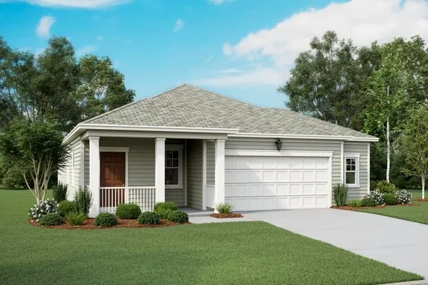 a front view of a house with a garden and yard