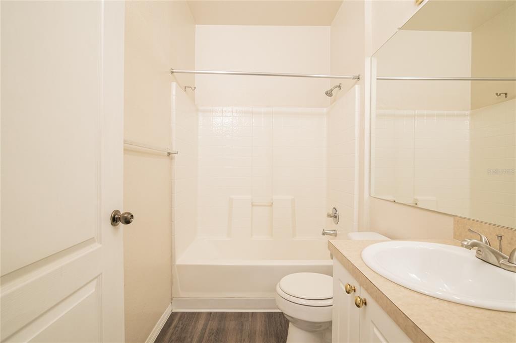 3391 South Kirkman Road, Unit 1216 Orlando, FL 32811 - Photo 19 of 33 a bathroom with a sink toilet and shower