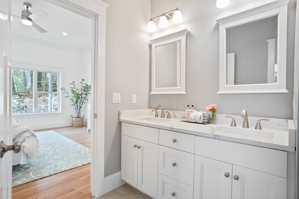 19 High Popples Road, Unit A Gloucester, MA 01930 - Photo 17 of 24 a bathroom with double sink and a mirror