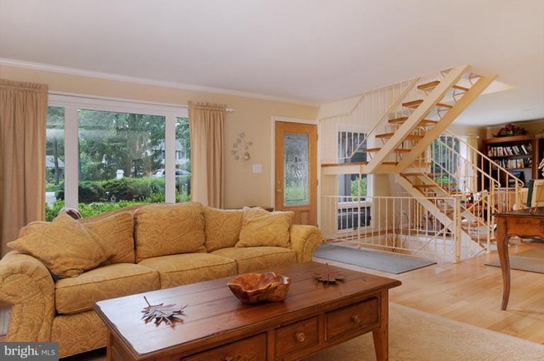 12104 Stirrup Road Reston, VA 20191 - Photo 16 of 27 a living room with furniture and a large window