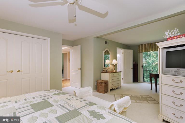 12104 Stirrup Road Reston, VA 20191 - Photo 18 of 27 a bedroom with a bed and a television