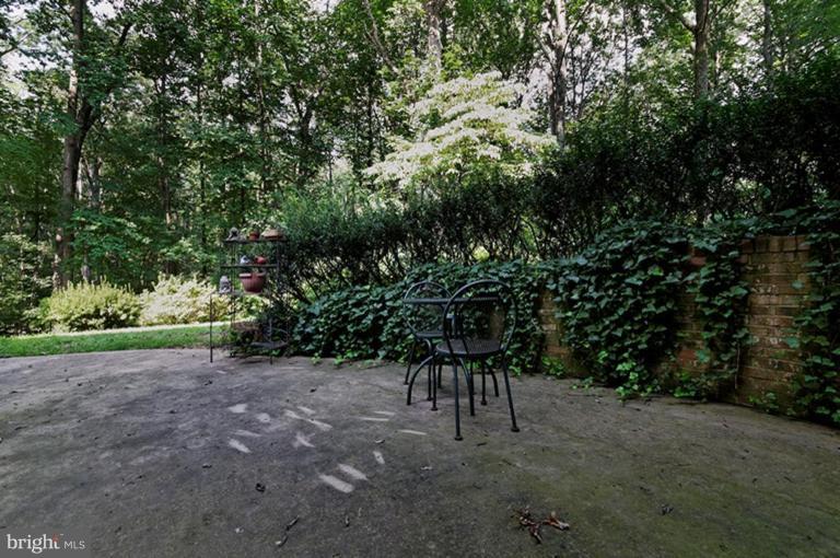 12104 Stirrup Road Reston, VA 20191 - Photo 21 of 27 a view of house with backyard and sitting area