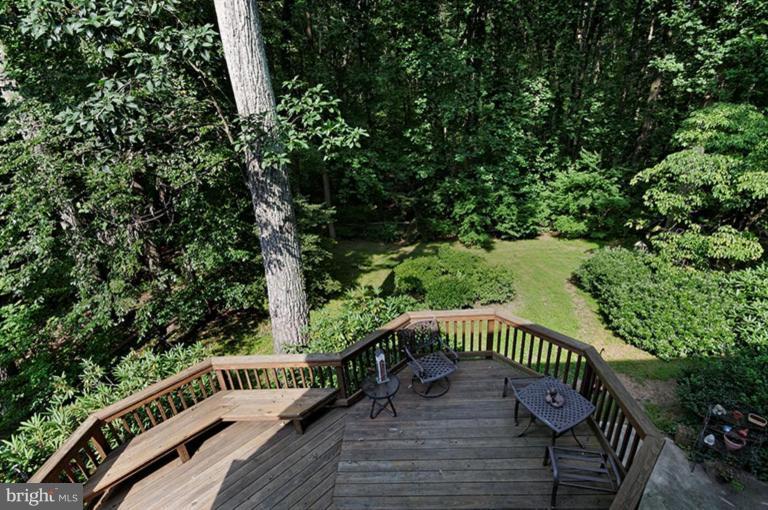 12104 Stirrup Road Reston, VA 20191 - Photo 24 of 27 a view of a wooden deck with a trees