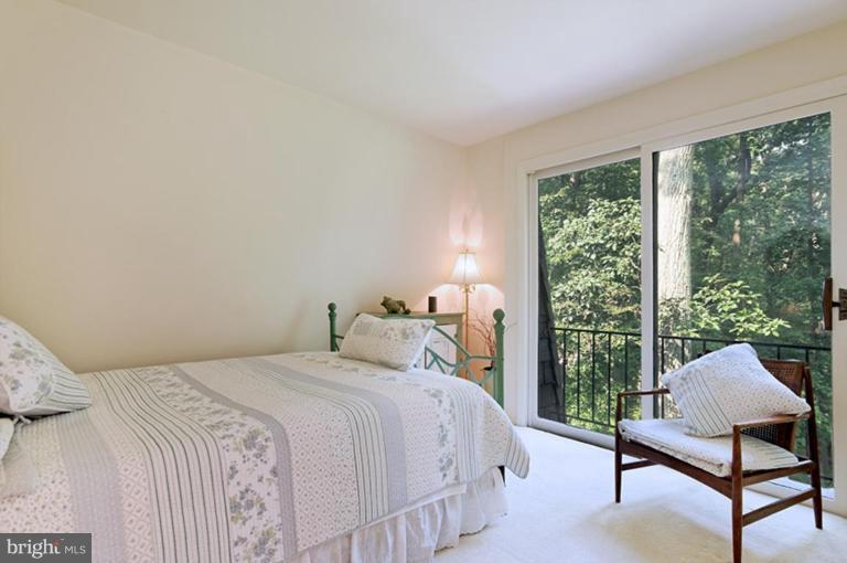 12104 Stirrup Road Reston, VA 20191 - Photo 5 of 27 a bedroom with a bed chair and a window