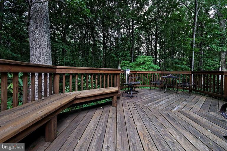 12104 Stirrup Road Reston, VA 20191 - Photo 7 of 27 a view of deck with wooden floor and outdoor seating