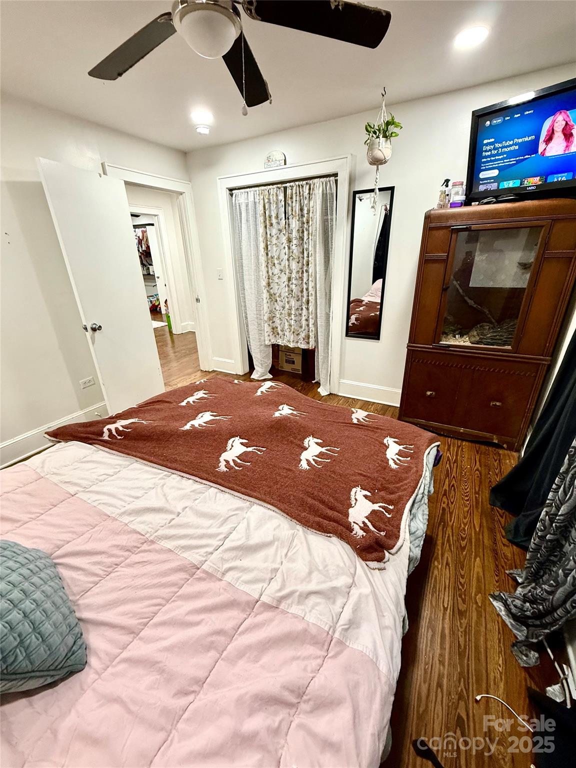 245 Church Street Ellenboro, NC 28040 - Photo 11 of 18 a bedroom with a bed and a flat screen tv
