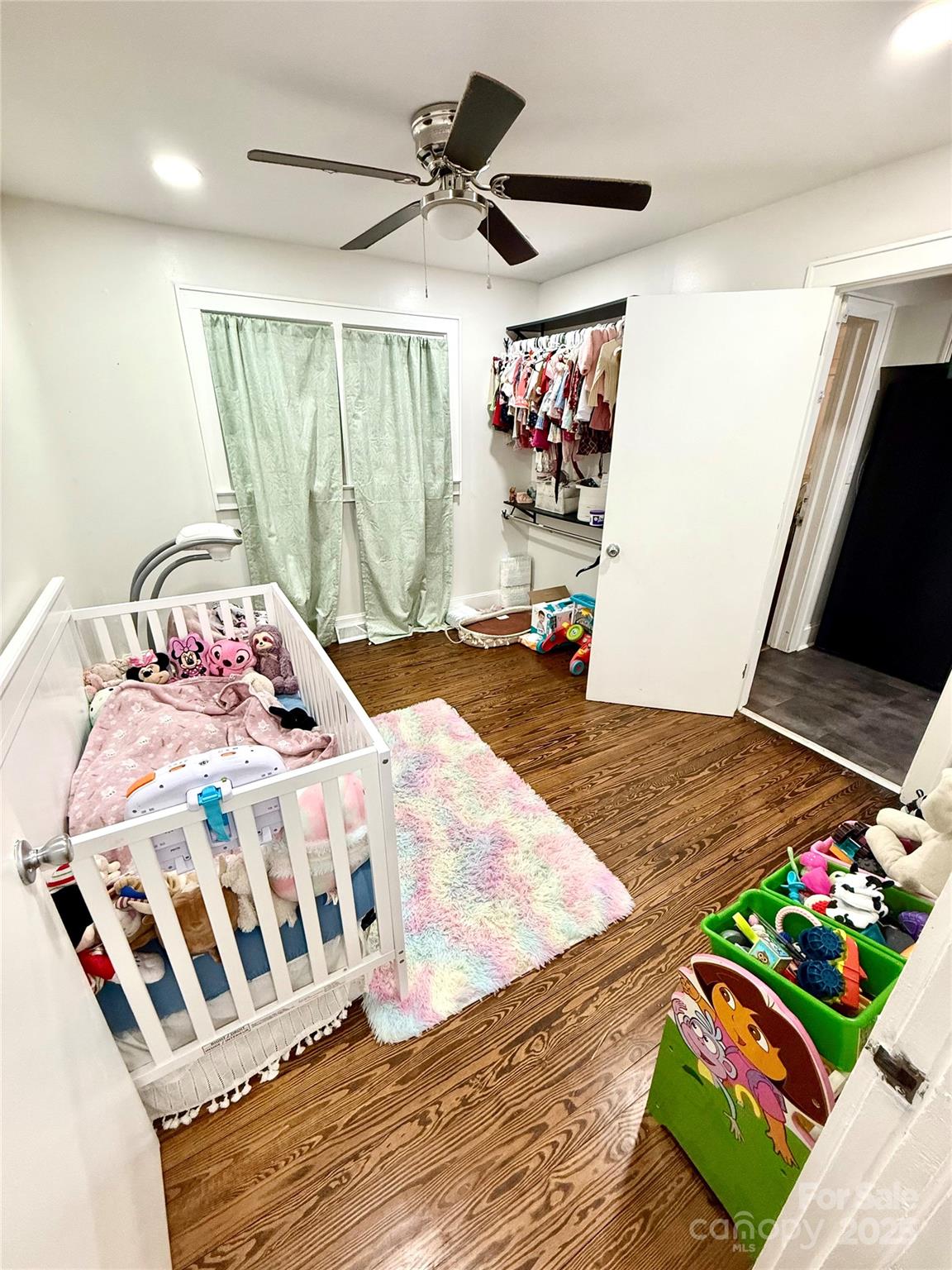 245 Church Street Ellenboro, NC 28040 - Photo 15 of 18 a bedroom with a bed and a flat screen tv